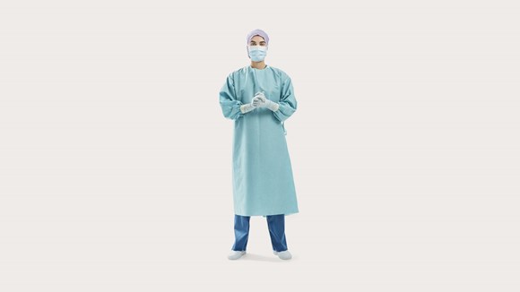 Professionele zorgverlener die een BARRIER operatiejas draagt
